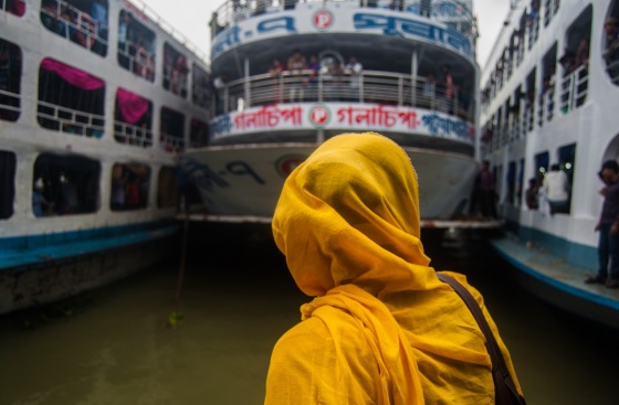 A women could not reach to the terminal in time due to heavy rain. And she found the launch she supposed to travel have just started and she have no other option rather than just watching it.